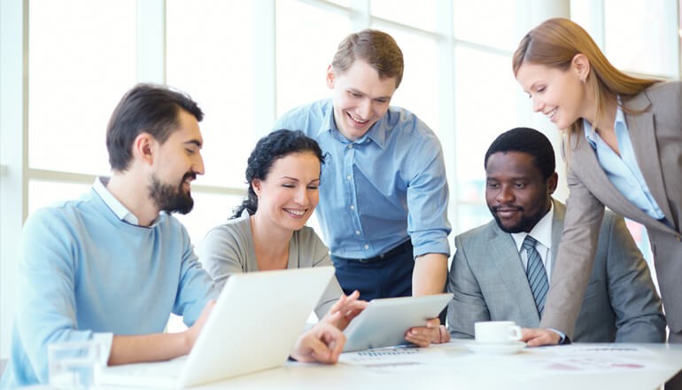 Small business team looking at a tablet Small business team looking at a tablet