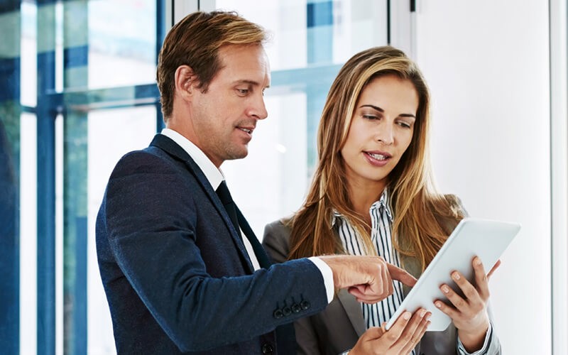 IT professional working on computer in data center
