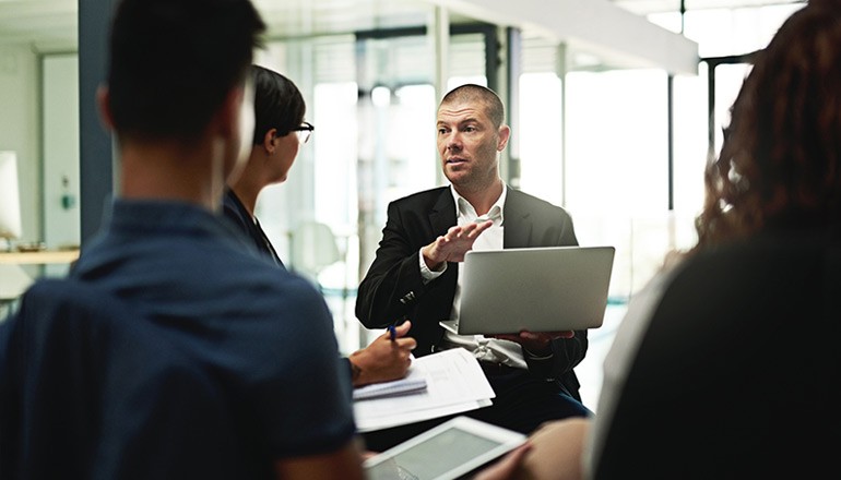 Team discussing software asset management solutions