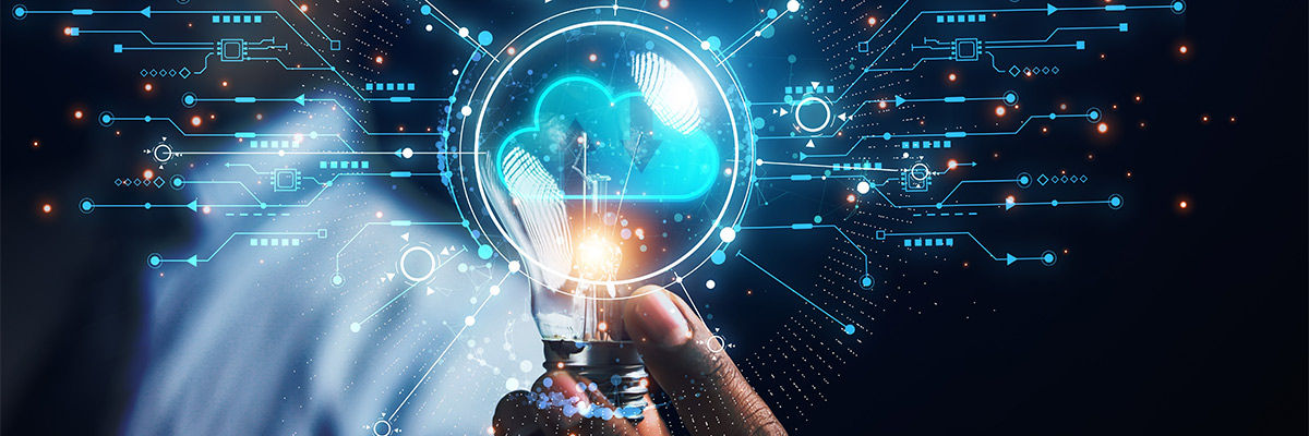 Unlock Cloud's Economic Advantage Guy holding a lightbulb representing cloud.