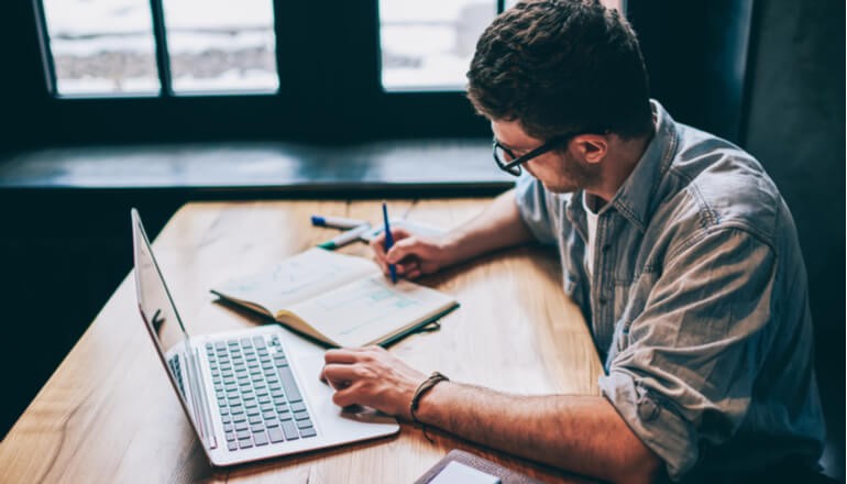 User working on laptop
