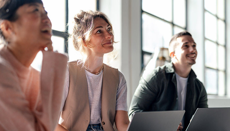 Team in office listening to presentation