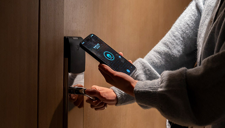 Insight + Cisco Hospitality Webinar Series: Enhancing Hotel Security Hotel guest checking in into hotel room