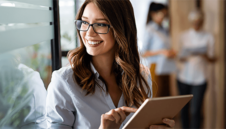 Woman smiling and looking off in the distance. Mimecast, Email Security Cloud Integrated, email security, Microsoft 365, AI security, cyberattack security, ransomware protection