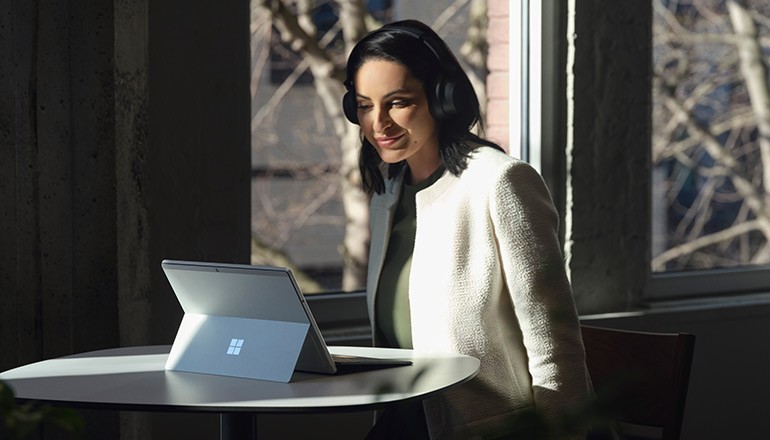 The Value of Microsoft Surface Webinar Woman using Microsoft Surface device
