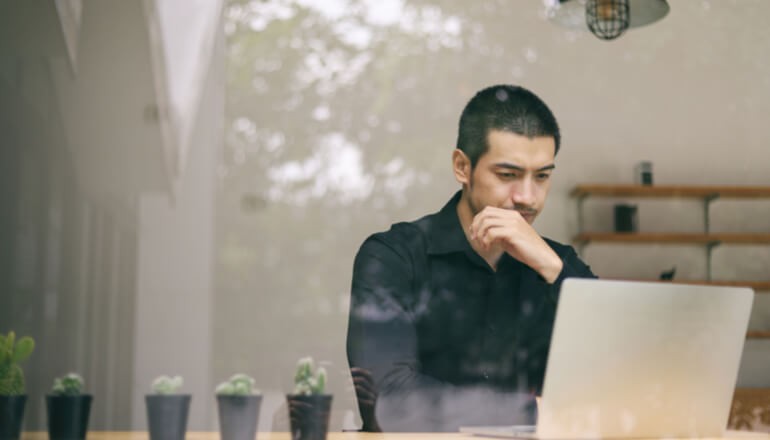 Transformation in the Cloud — At What Cost? User working on laptop