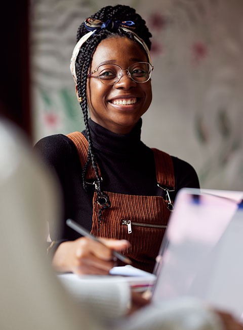 woman-smiling-higher-education-computer-studying