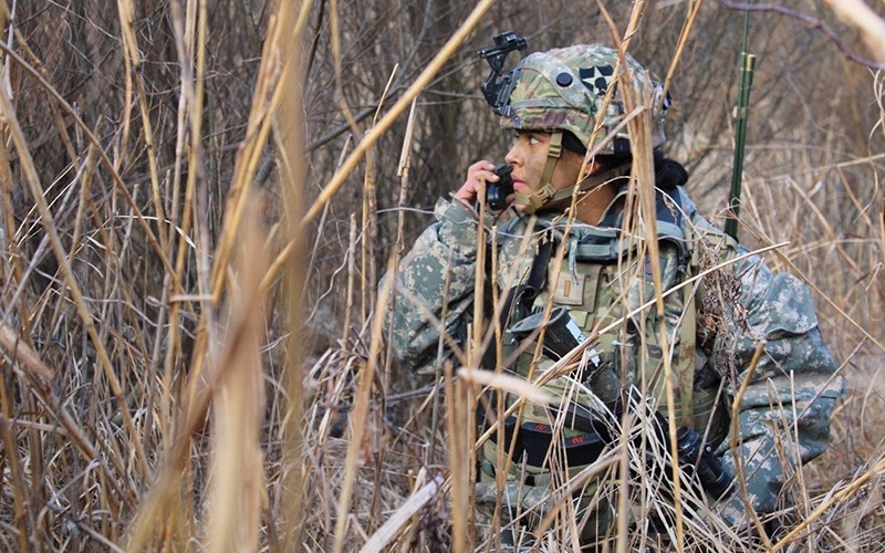 dod-lifestyle-female-using-communication-device-in-field dod-lifestyle-female-using-communication-device-in-field