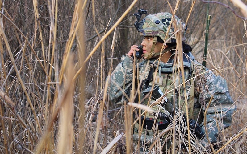 dod-lifestyle-female-using-communication-device-in-field
