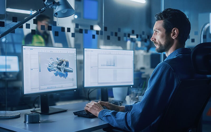 Give your workspace a boost. Man using dual monitor