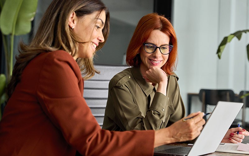 Two woman collaborating