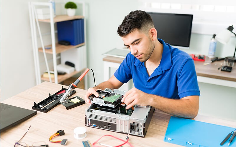 Man fixing electronics and peripherals