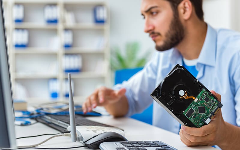 Man holding hardware storage