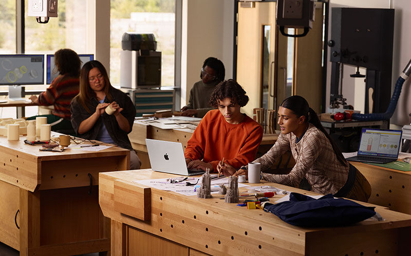 Evolve your workplace technology. Woman working on a desktop computer