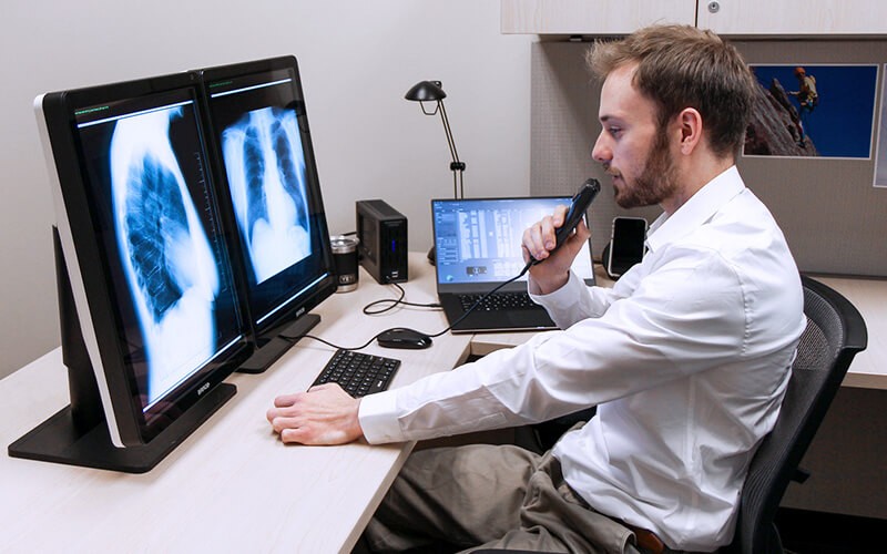 Insight and Dell offer a secure, compliant and trusted approach to protect your most sensitive data. Man checking the xray results