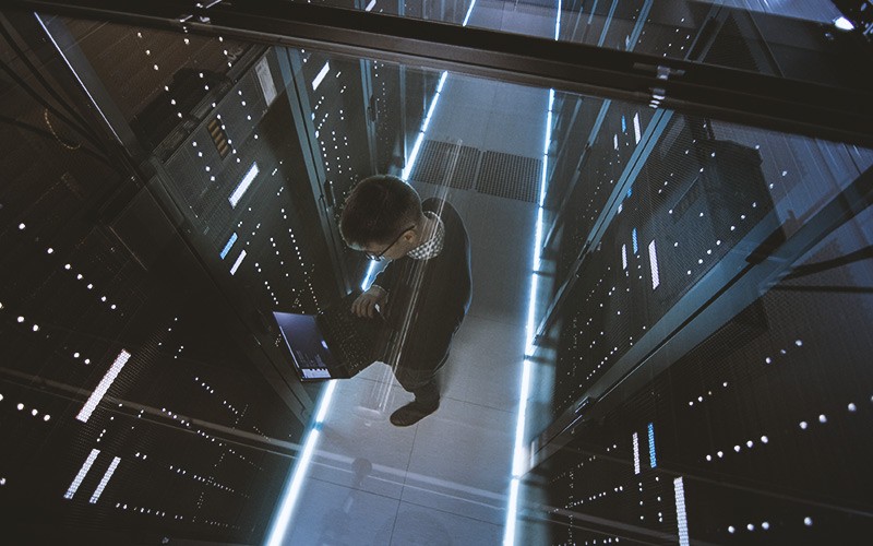 Professional working on Dell server in server room