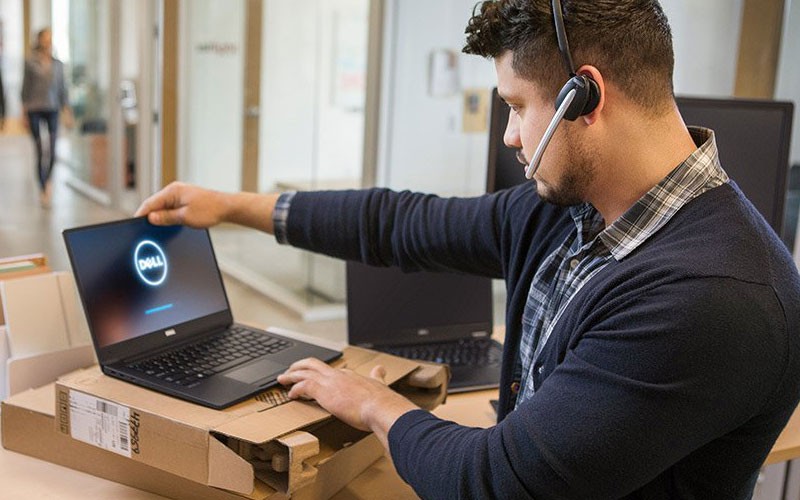 Give your employees the tools they need to perform productively. Dell IT technician using laptop