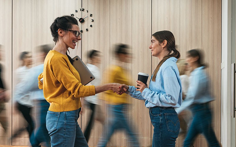 Employees shaking their hands