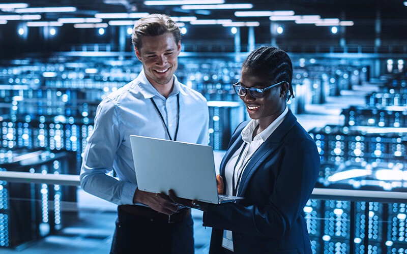 Two person collaborating inside the data center