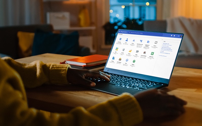 Person using a laptop with Google workspace