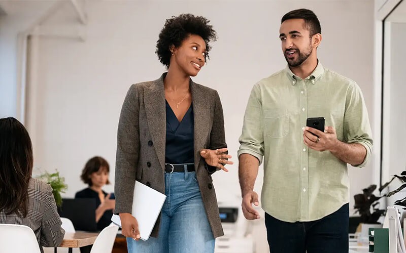 Two users walking with Anroid devies
