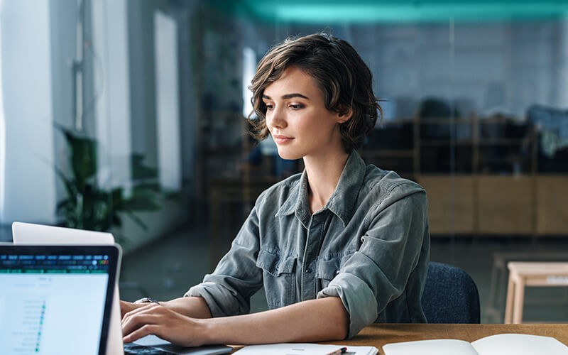 Woman using her laptop at the office