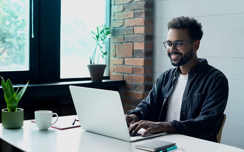 Man using his laptop at work