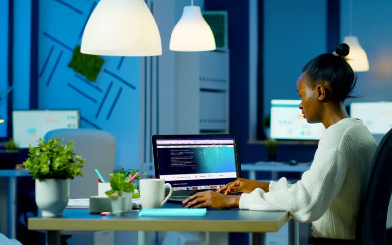 Woman using her laptop at the office