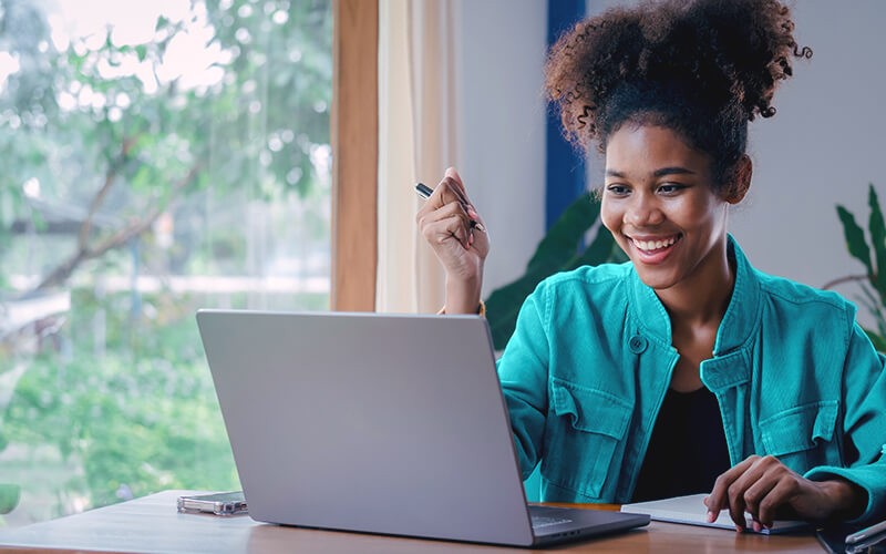 Curly hair woman using her laptop