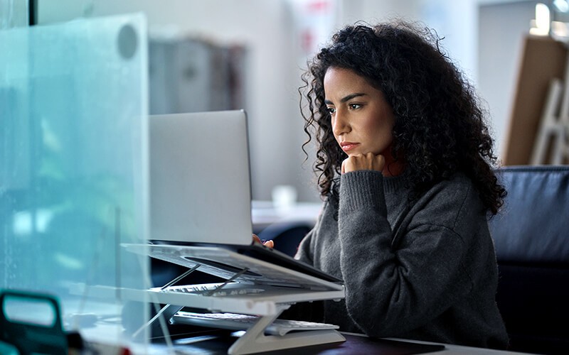 Woman usign her laptop at the office