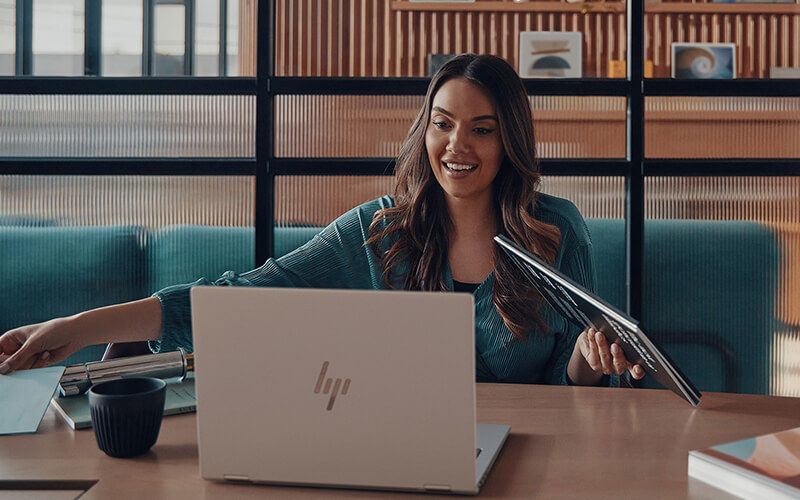 What can HP AI solutions do for you? Woman using a HP laptop