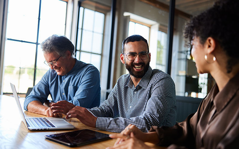 Power every aspect of your businesses Business professionals review data on a tablet computer