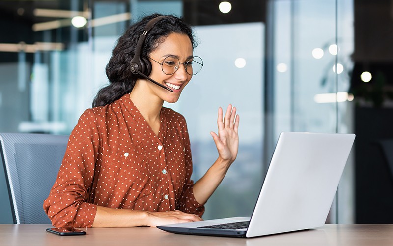 Multifunction headsets Woman using a laptop with headphone