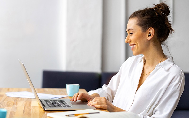 True wireless earbuds Woman working using JLab TWS