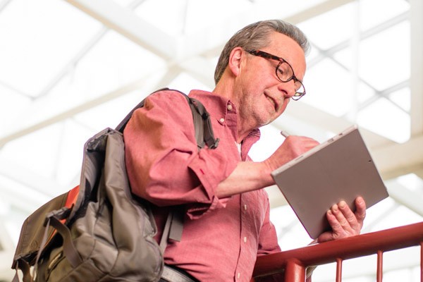 IT executive on business tablet