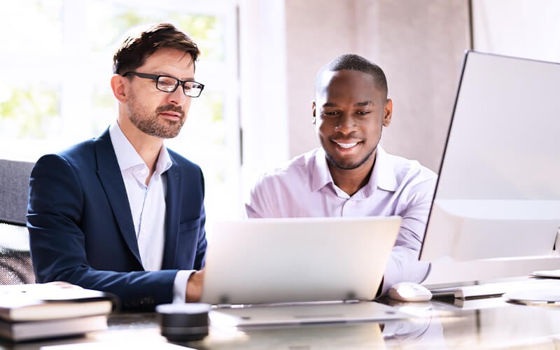 Unified endpoint management Teammates working together at the office