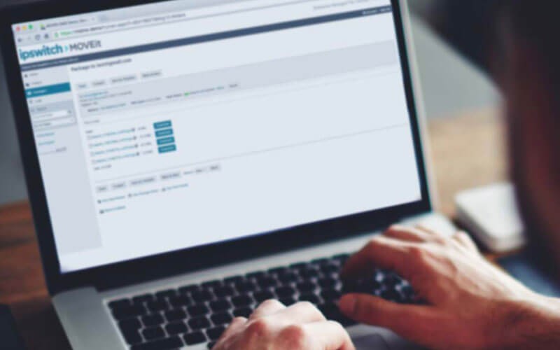 Ipswitch MOVEit puts you in control of fast, secure file transfers to partners, customers, users and systems Hands on device showing MOVEit product