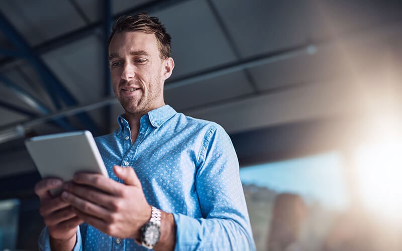 Business man looking at tablet