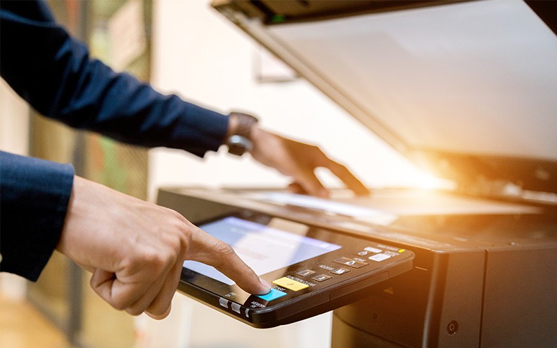 Businessman using printer
