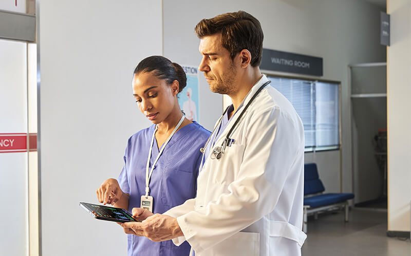 Doctor and nurse talking with each other