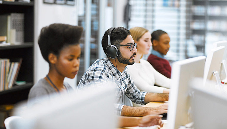 Simplify UPS management. work team using computer