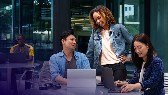 Employees having meetings in outdoor courtyard with mobile PC with Snapdragon