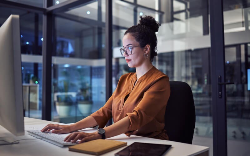 Woman with glasses working