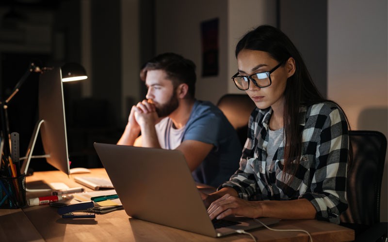 TBI Software-Defined Wide Area Network (SD-WAN) technology Two teammates working at night