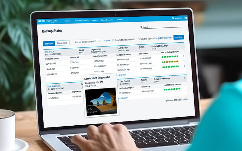Man working on laptop using Unitrends app
