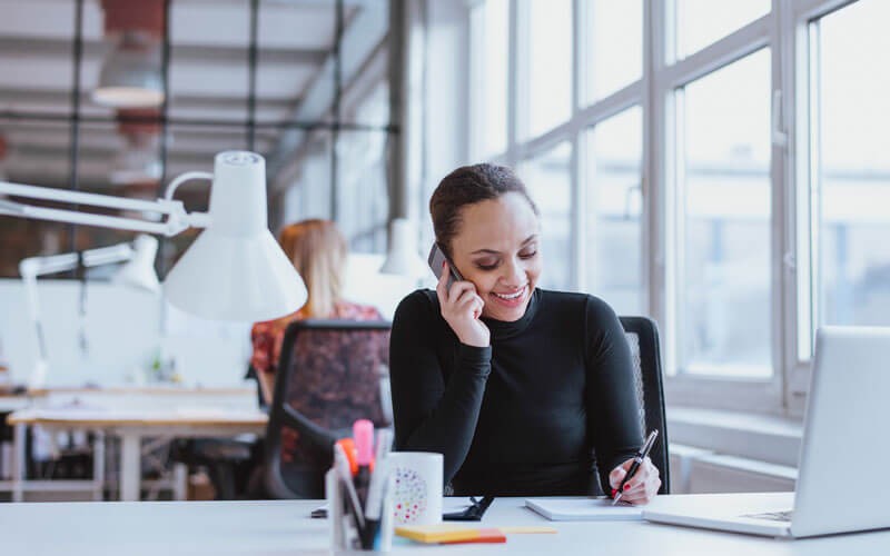 Woman smiling on the phone