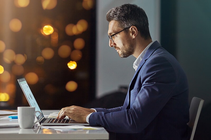 Business professional using Insight's Flex for Devices technology solution in modern office environment